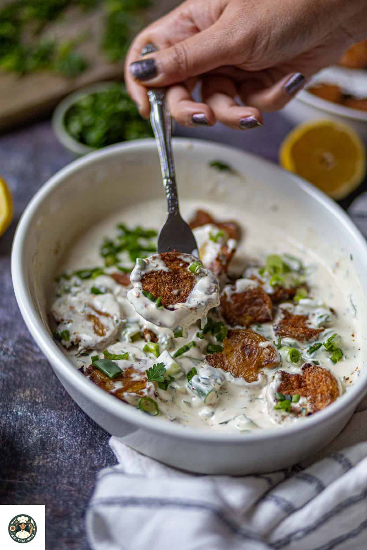 Image showing a spoonful of smashed potato salad recipe.