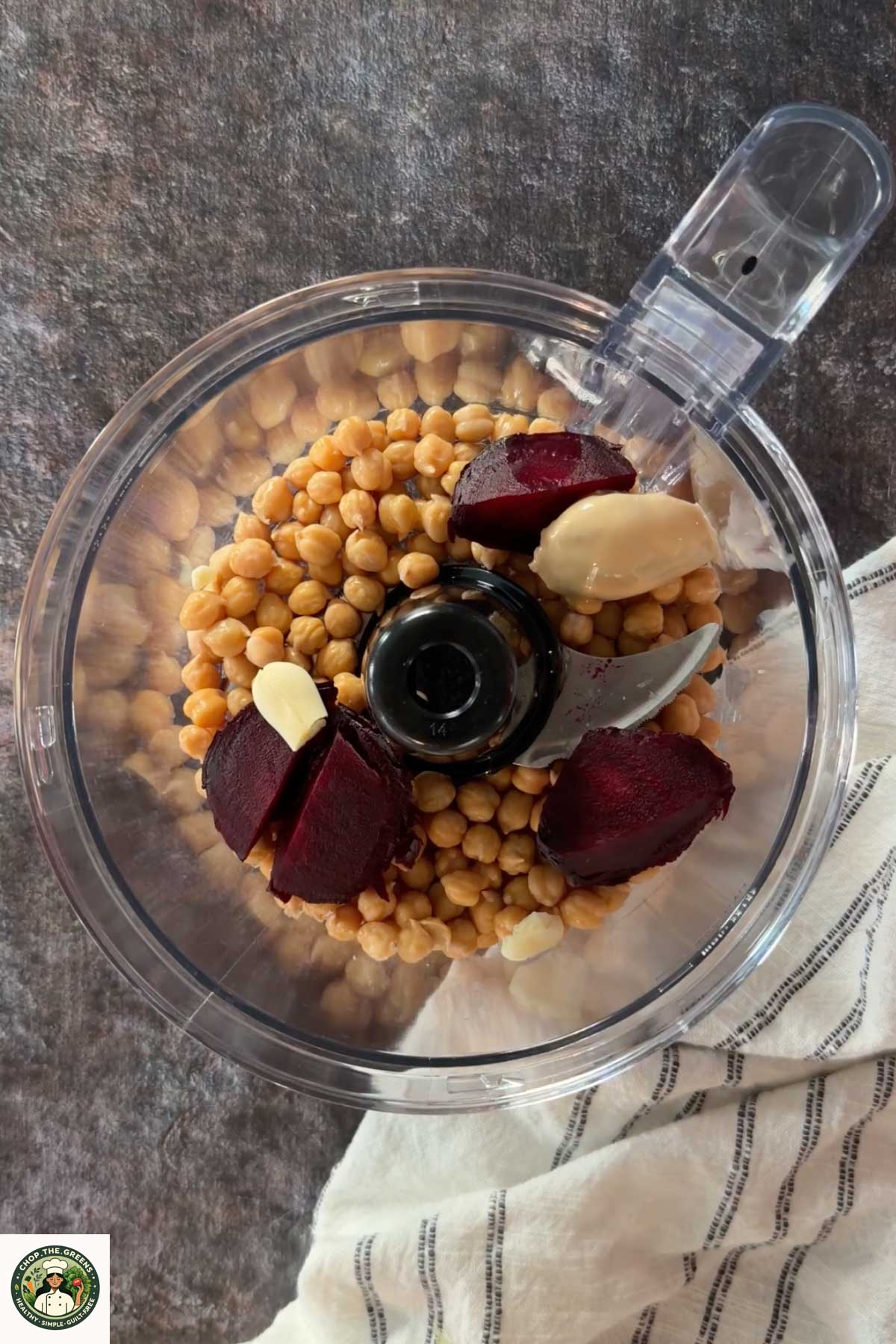 Beetroot hummus ingredients in a food processor before blending.