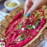 Beetroot hummus recipe served as a colorful appetizer platter.