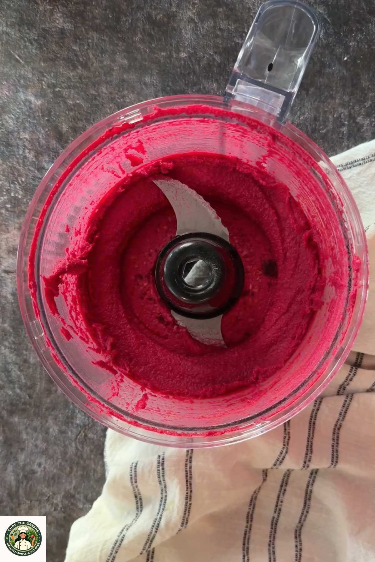 Freshly blended beetroot hummus in a food processor.