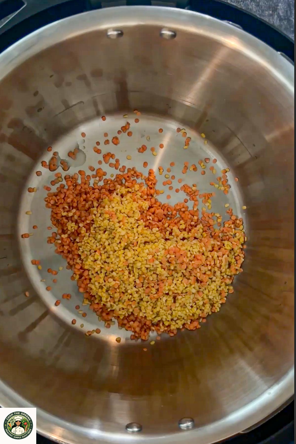 Red and yellow lentils in an Instant Pot inner pot.