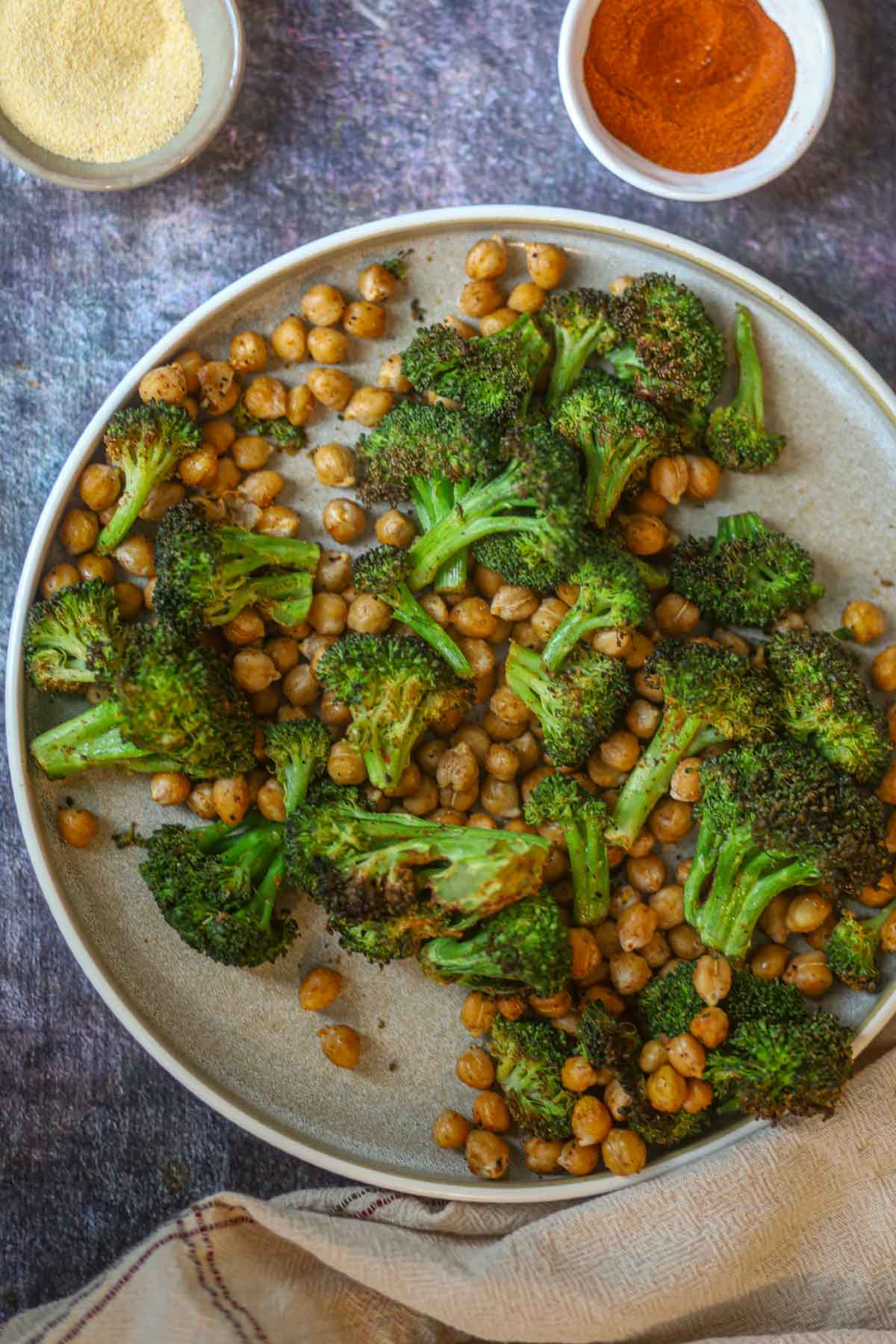 Ingredients for air fryer broccoli and chickpeas including spices and lemon.