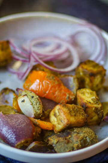 Hariyali paneer tikka made in air fryer with onions and bell peppers.