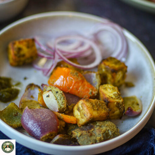 Hariyali paneer tikka made in air fryer with onions and bell peppers.