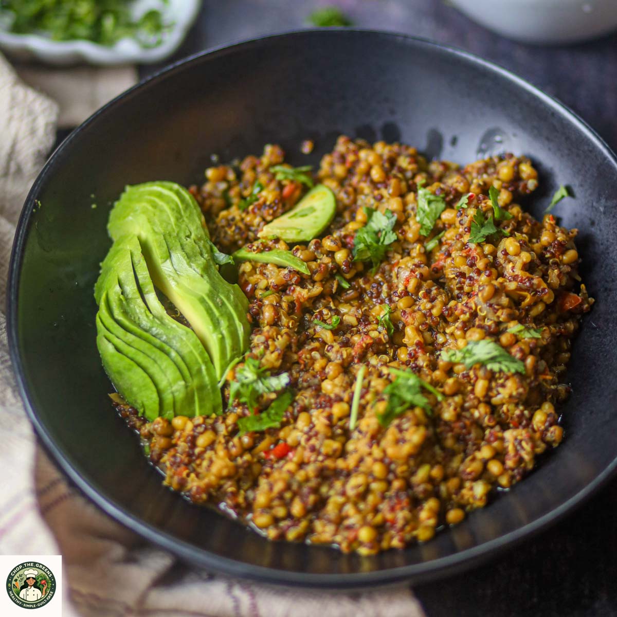 Instant Pot lentil and quinoa protein bowl topped with avocado and herbs
