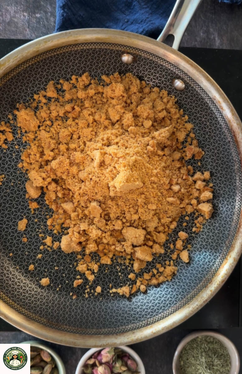 Grated jaggery i the pan to make syrup for peanut gajak.