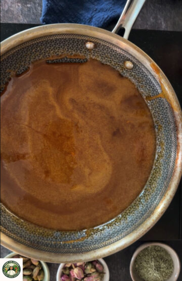 Melted jaggery syrup at the right stage for peanut chikki.