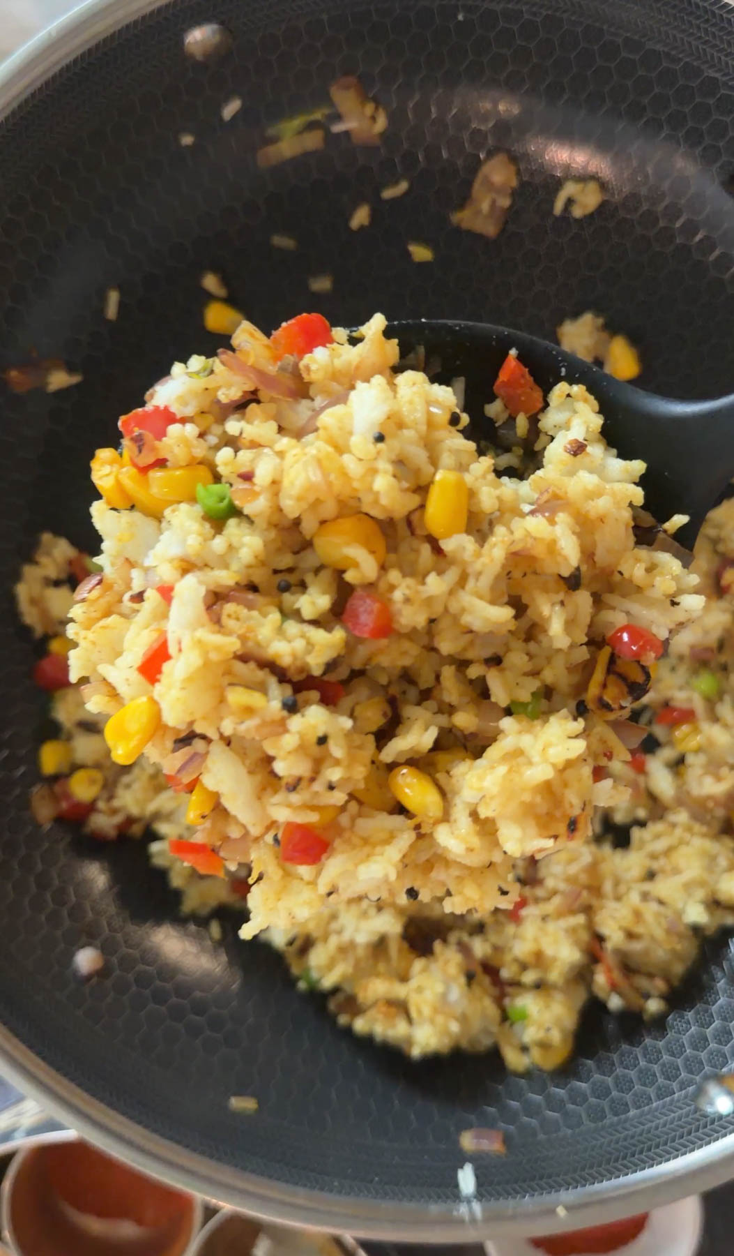 Spiced rice and vegetables cooked for paneer tikka bowl base.