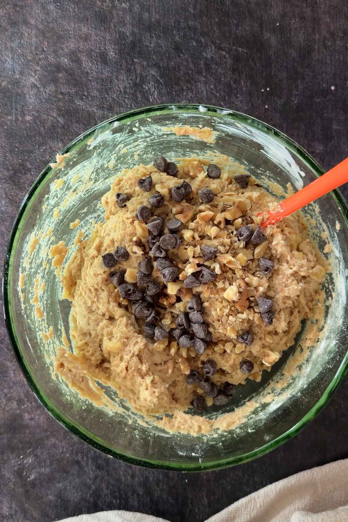 Chocolate chips and chopped nuts added to banana bread batter.