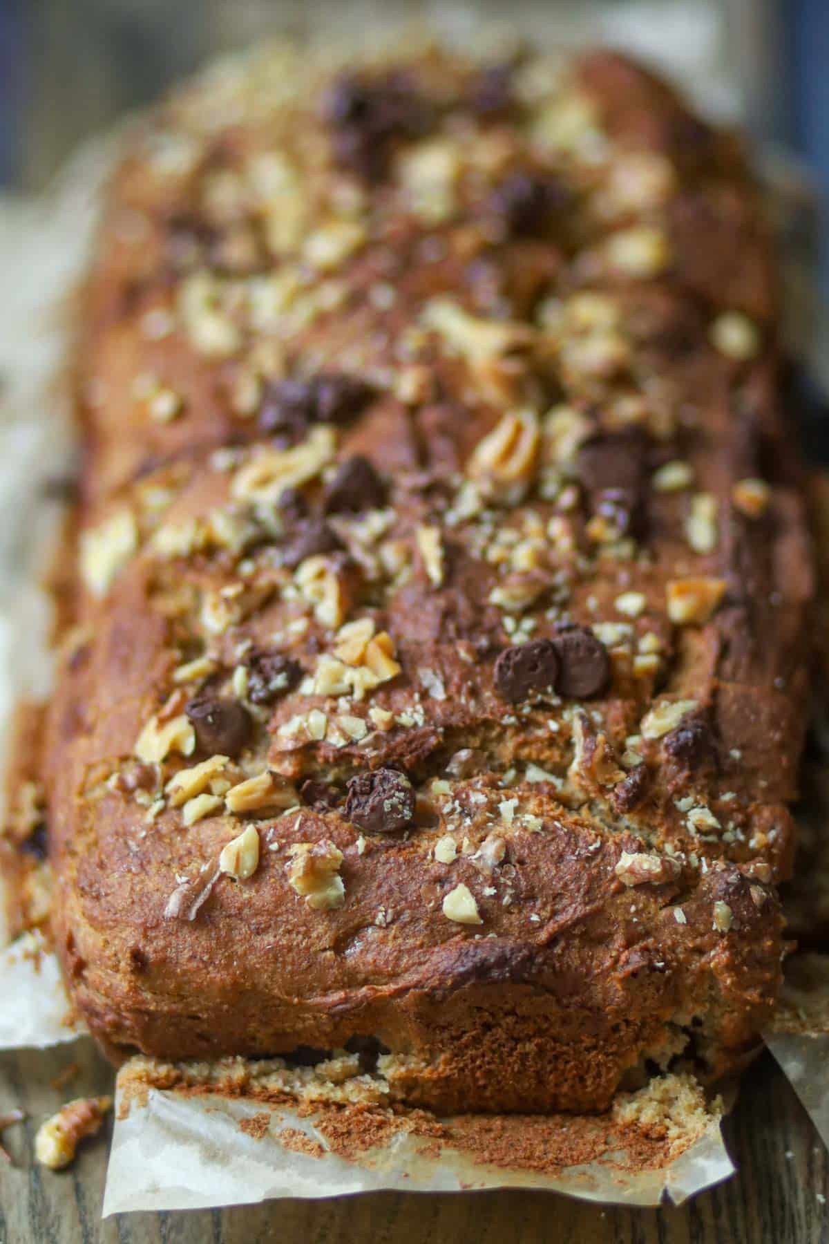 Top view of homemade banana bread with chopped nuts.
