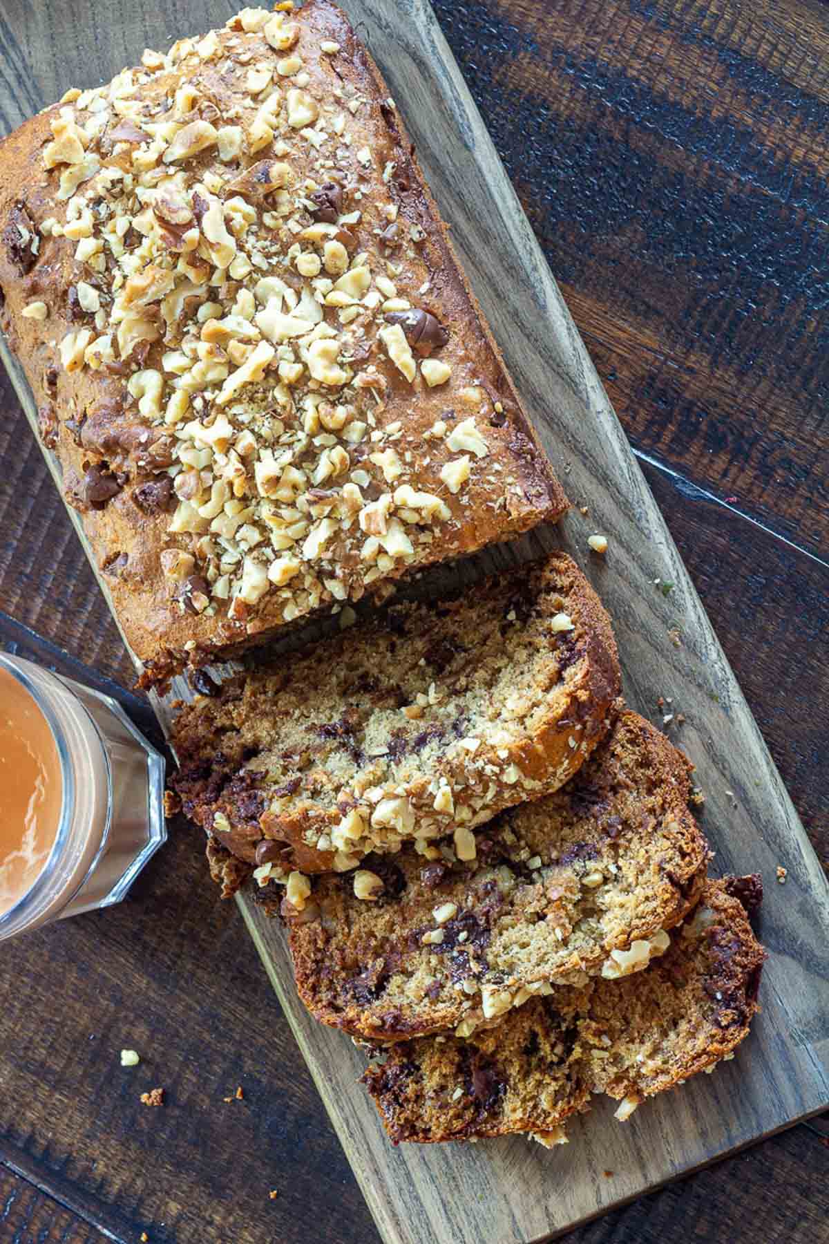 Close-up of moist banana bread slices with chocolate chips and nuts.