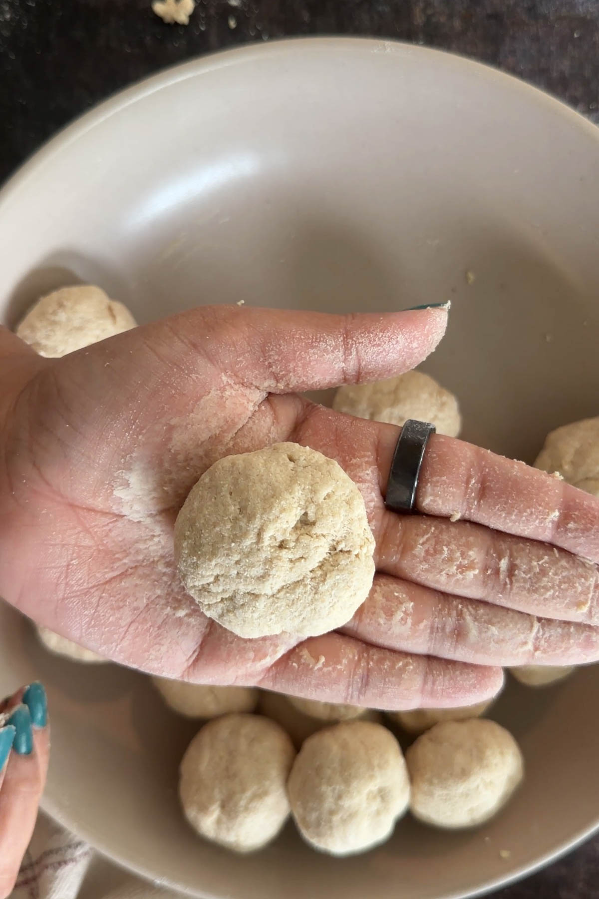Make small balls from the rested atta dough.