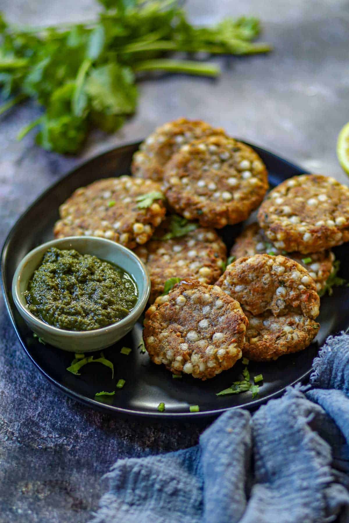 Crispy air fryer sabudana vada with green chutney.