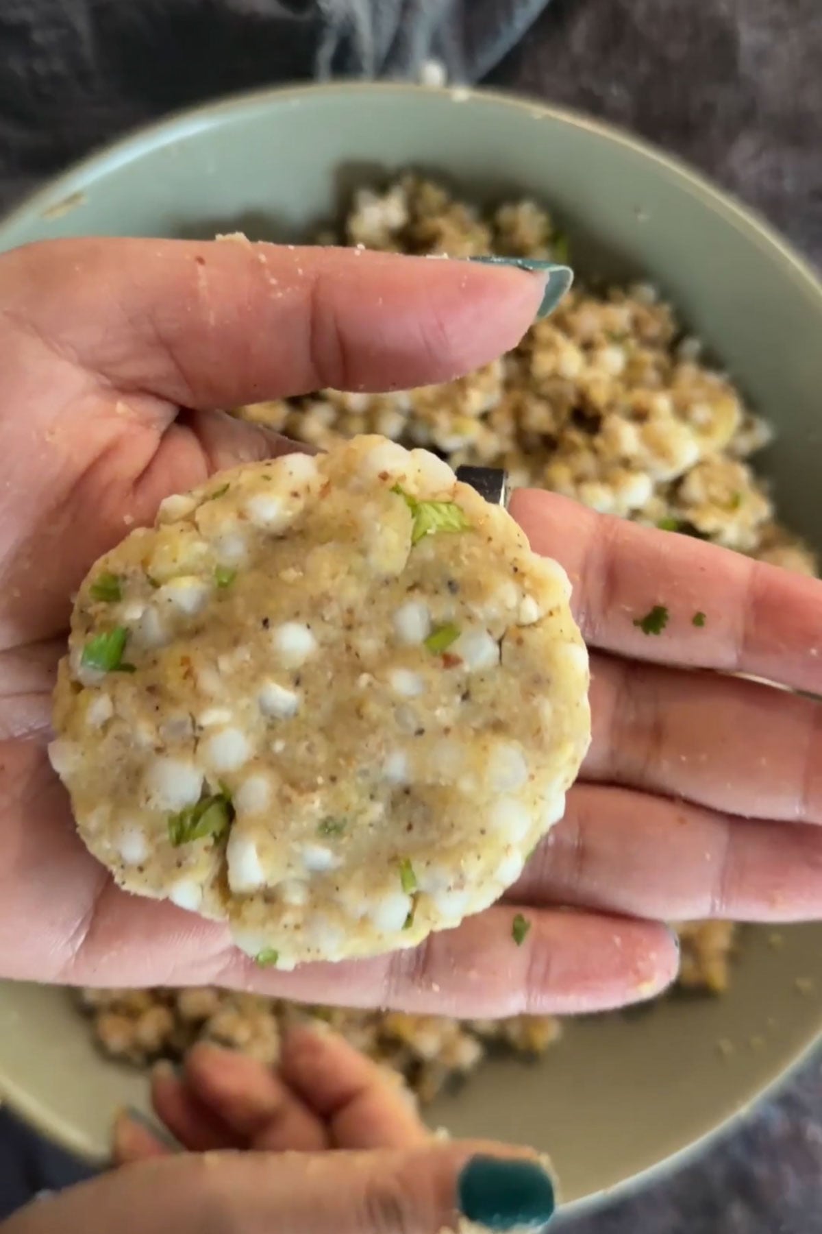 Shaping sabudana vada into a patty.