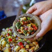 Air fryer sweet potato chaat with vegetables, chutneys and peanuts.
