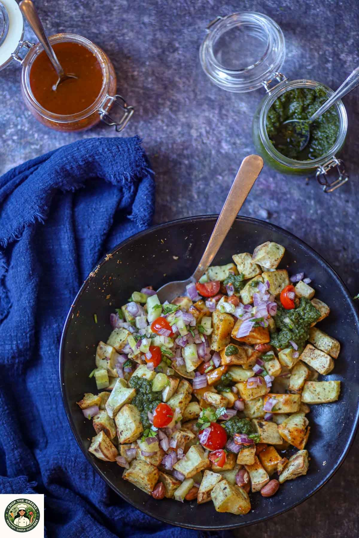 Sweet potato chaat topped with green and tamarind chutney.